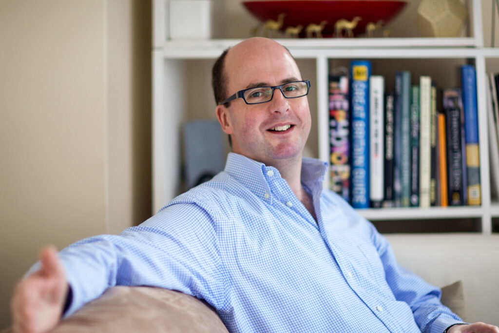 Portrait of an adult man with glasses